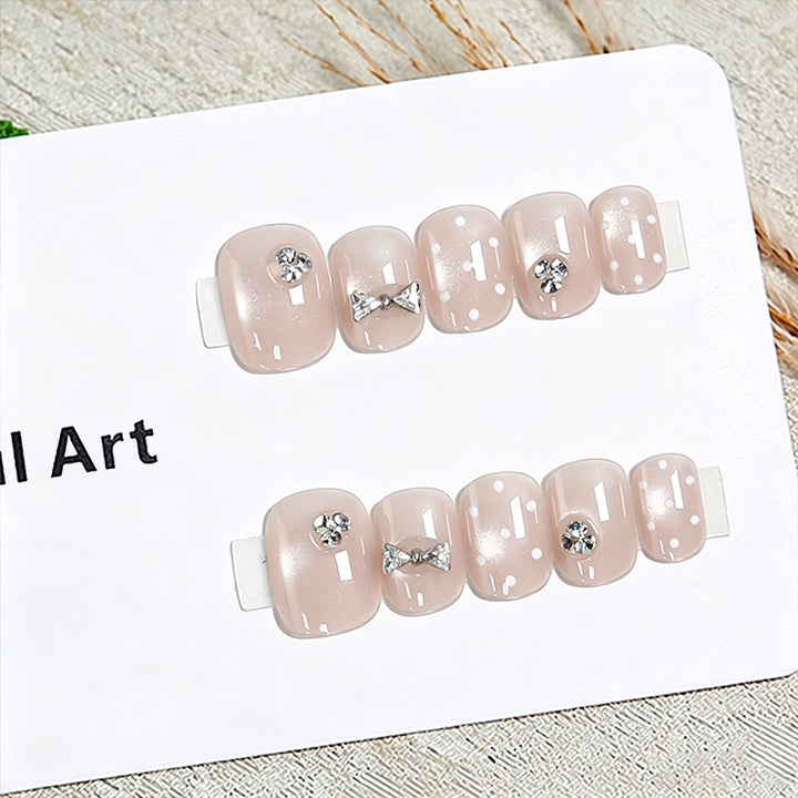 Artificial nail set with elegant glitter and crystal decorations Bowlift