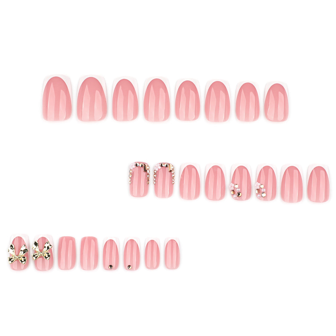 Elegant Nail Extensions with French Tips and Decorative Accents Bowlift