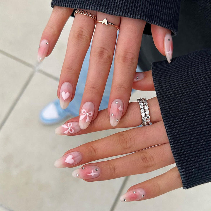 Acrylic nail set with romantic heart and bow design Bowlift