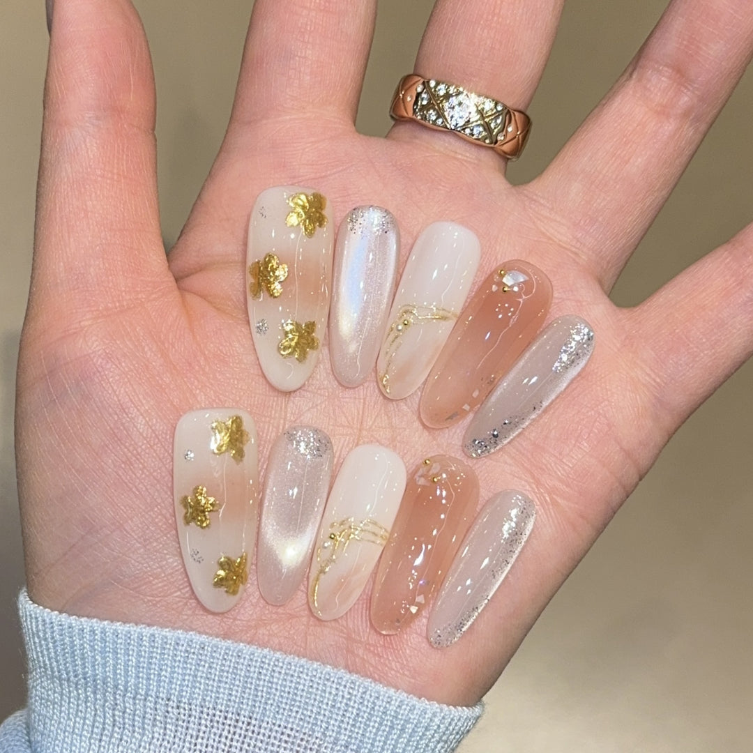 Artificial nails with floral decorations and glitter effects Bowlift