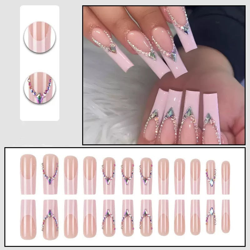 Glamorous artificial nails with sparkling rhinestone embellishments Bowlift
