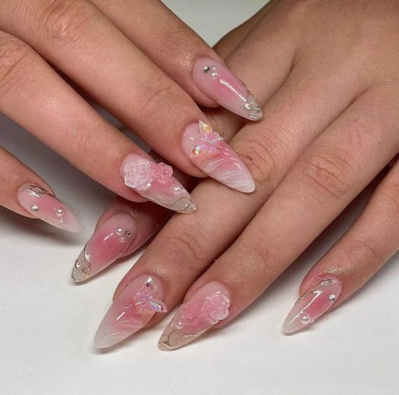 Artificial nail creation with floral 3D details and glitter accents Bowlift