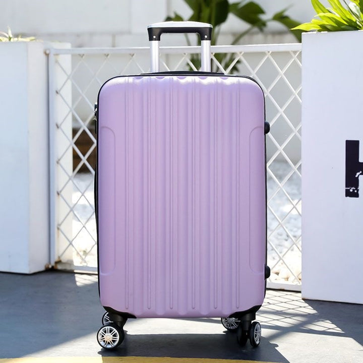 Hard shell suitcase with 360-degree wheel system and integrated safety feature Bowlift