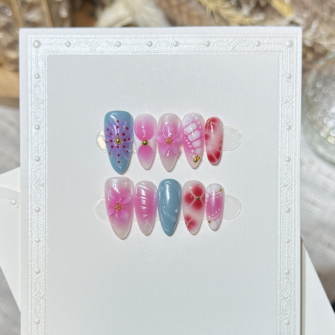 Artistic Press-On Nail Set with Floral and Abstract Designs Bowlift