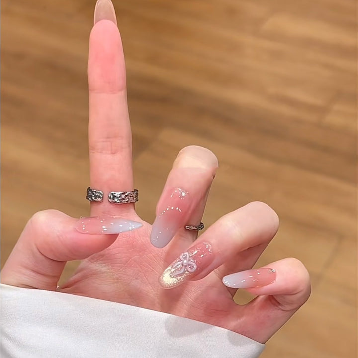 Artistic Press-On Nail Set with Floral and Glossy Accents Bowlift