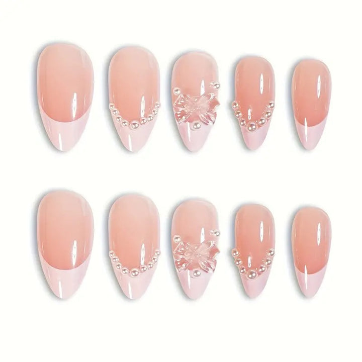 Art nail tips with delicate pearl and butterfly accents Bowlift