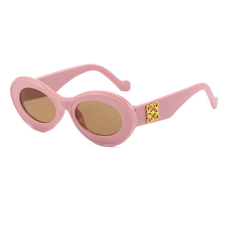 Women's fashionable sunglasses with oval frame and golden applications Bowlift