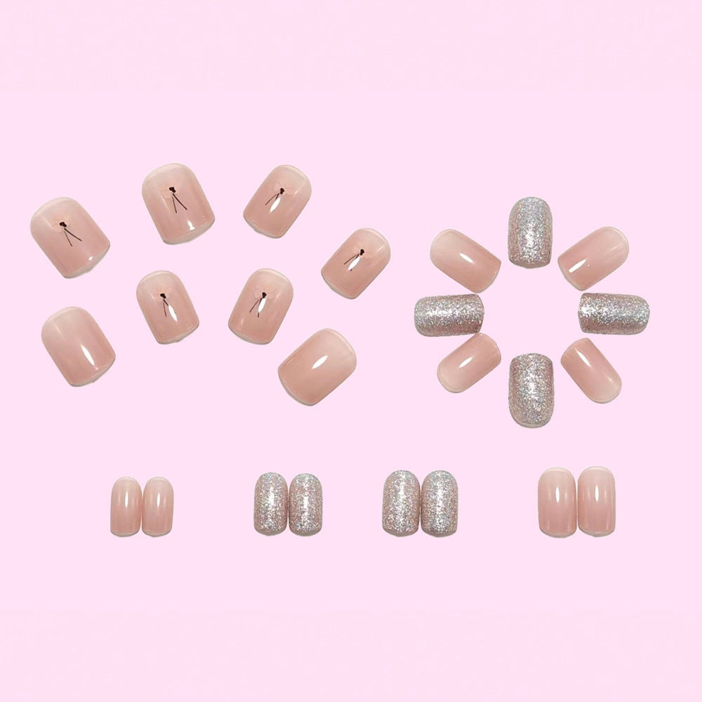 Artificial nails with sparkling accents and floral design Bowlift