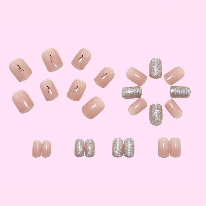 Artificial nails with sparkling accents and floral design Bowlift