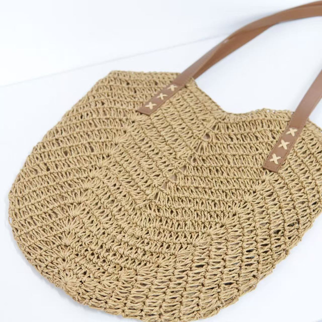Beach bag with mesh structure and tassel details Bowlift