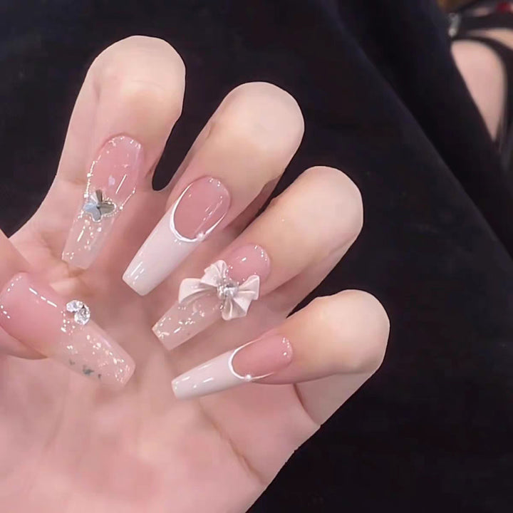 Artificial nails with glitter accents and playful motifs Bowlift