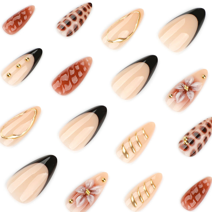 Artificial nails in modern stiletto design with golden accents Bowlift
