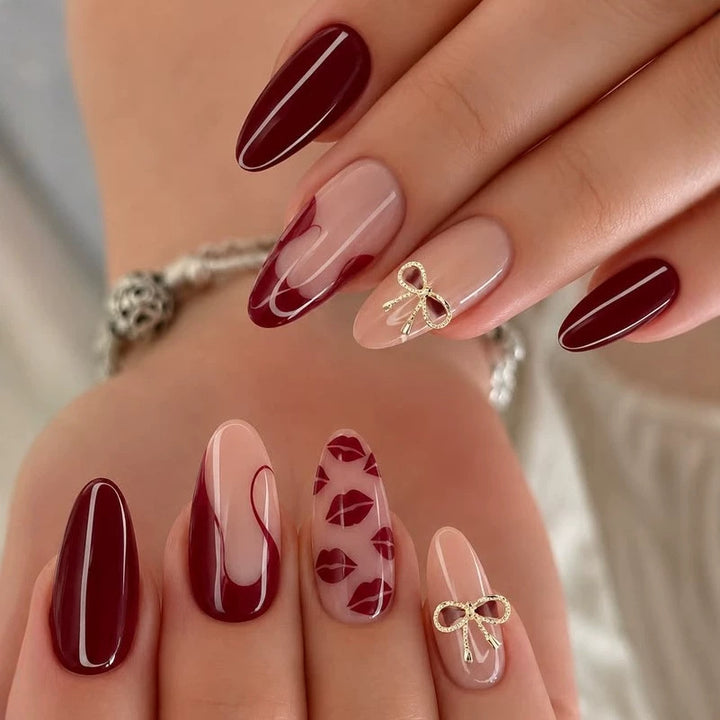 Acrylic nail set with elegant lip motifs and bow decorations Bowlift