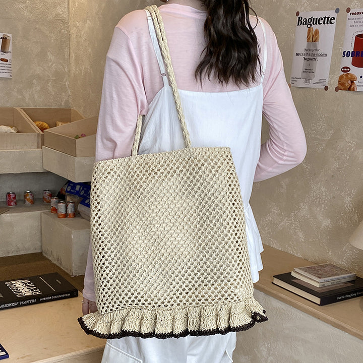 Handcrafted straw bag with fringed hem Bowlift