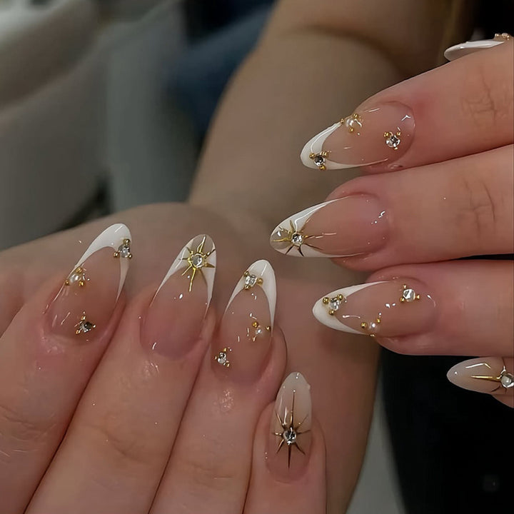 Glamorous nail art with rhinestones and gold accents Bowlift