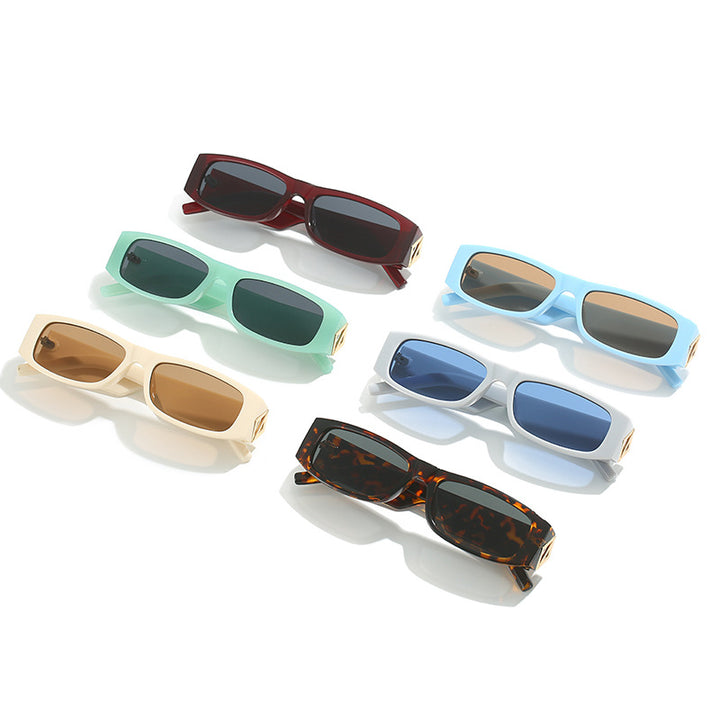 Ladies fashionable sunglasses with asymmetrical frame and gold-colored details Bowlift