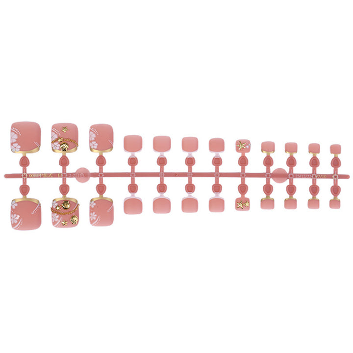 Artificial nail set with elegant, floral accents and golden decorations Bowlift
