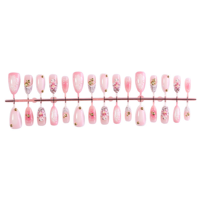 Creative acrylic nail set with elegant flower and glitter accents Bowlift