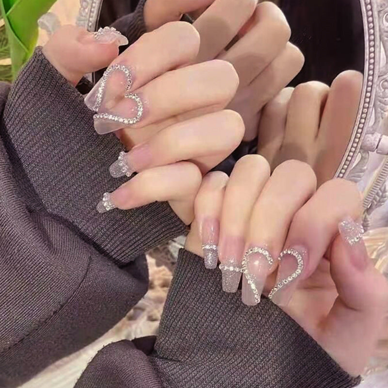 Glamorous artificial nails with heart and glitter design Bowlift