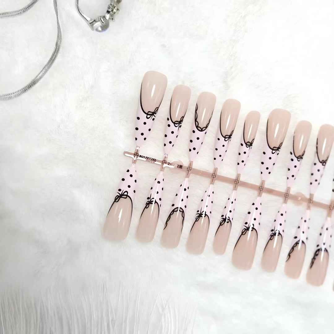 Elegant artificial nails with bow design and dots Bowlift