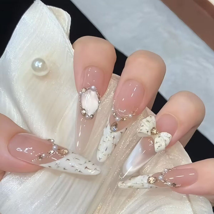 Artistic Stiletto Press-On Nail Art with Glimmering Accents Bowlift