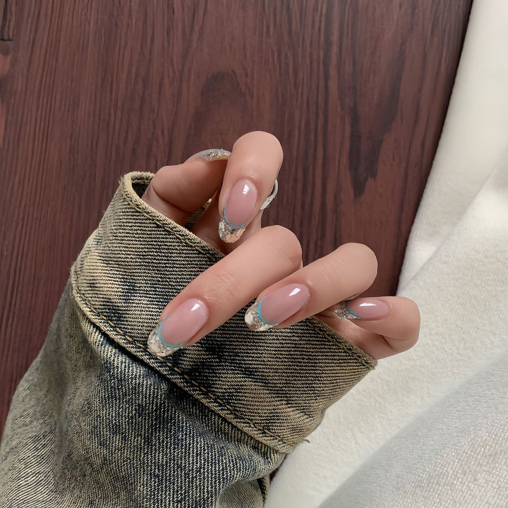 Artificial nails with shimmering glitter and elegant French-tip design Bowlift