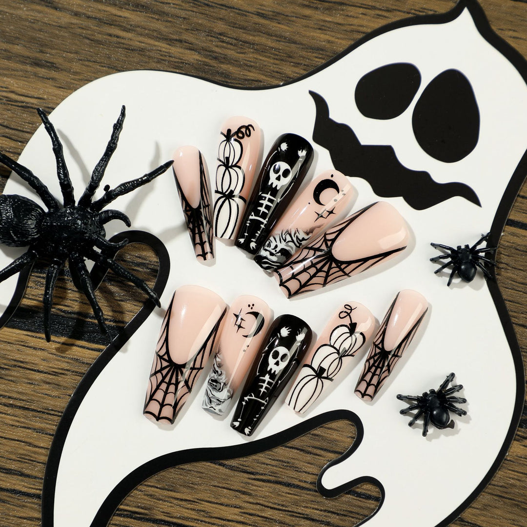 Artificial nail art in Halloween style with graffiti designs Bowlift