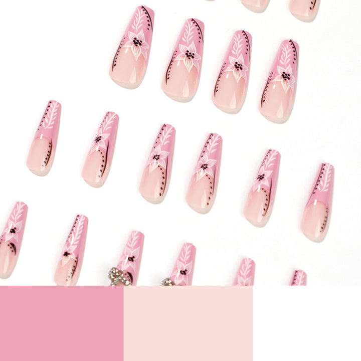 Artistic nail art with flower and heart motifs Bowlift