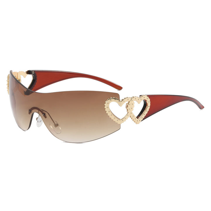 Ladies sporty sunglasses in trendy shield design with heart accents Bowlift
