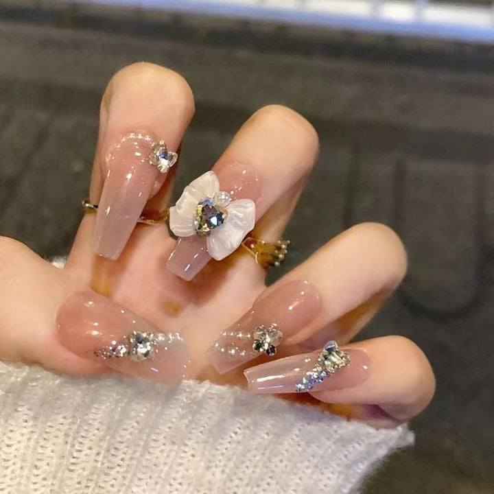 Glamorous artificial nails with moon and star motifs Bowlift