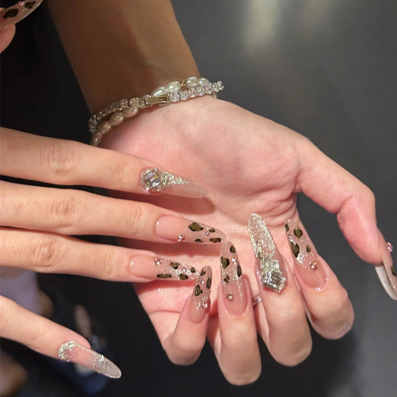Glamorous artificial nail set with fun leopard pattern and glittering accents Bowlift