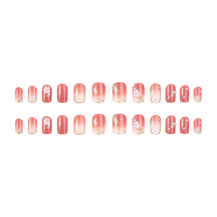 Acrylic nail set with elegant floral decorations and glamorous pearl accents Bowlift