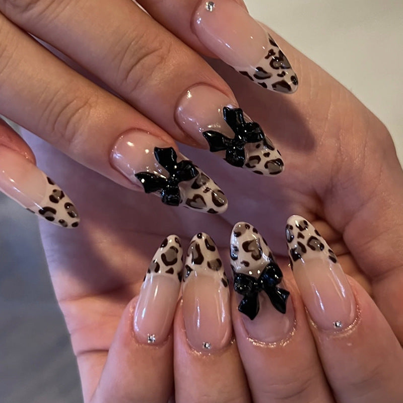 Creative artificial nails with stylish leopard pattern and bow accents Bowlift