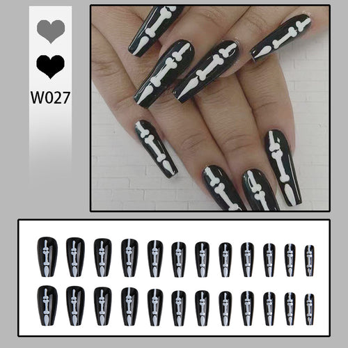 Artistic nail art with skull and bone motif Bowlift