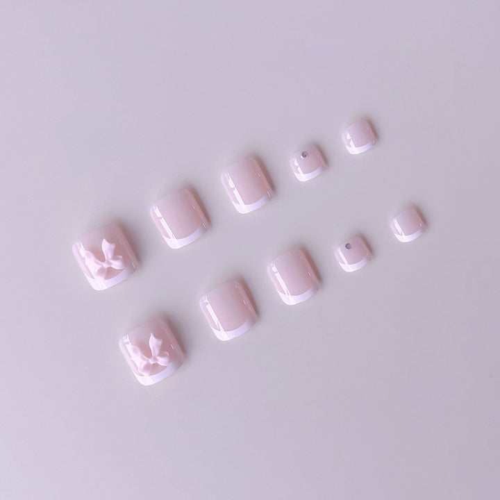 Nail art set with elegant French design and romantic bows Bowlift