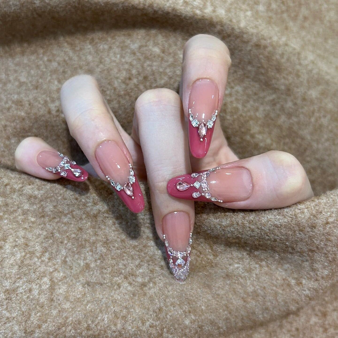 Artificial nails with sparkling rhinestone accents Bowlift
