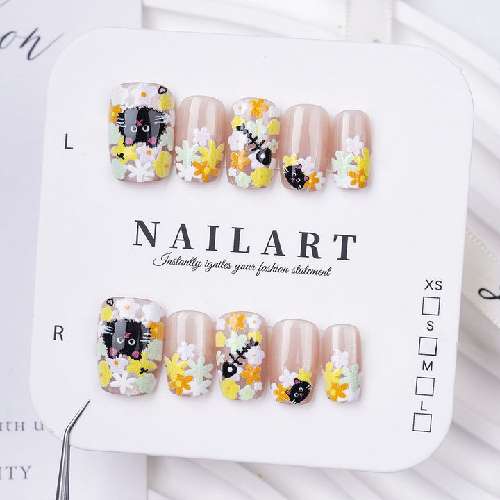 Artistic Stiletto Press-On Nail Set with Floral Embellishments Bowlift