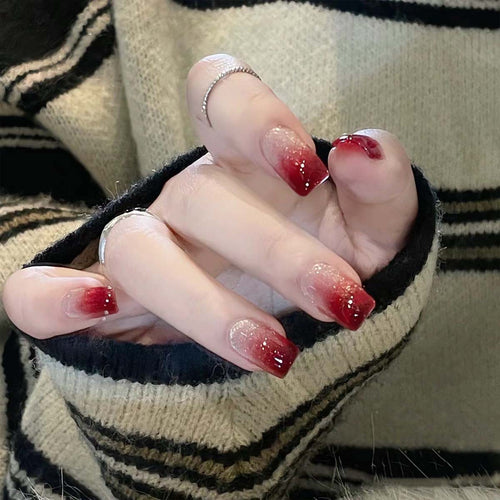 Glamorous artificial nails with glitter gradient Bowlift
