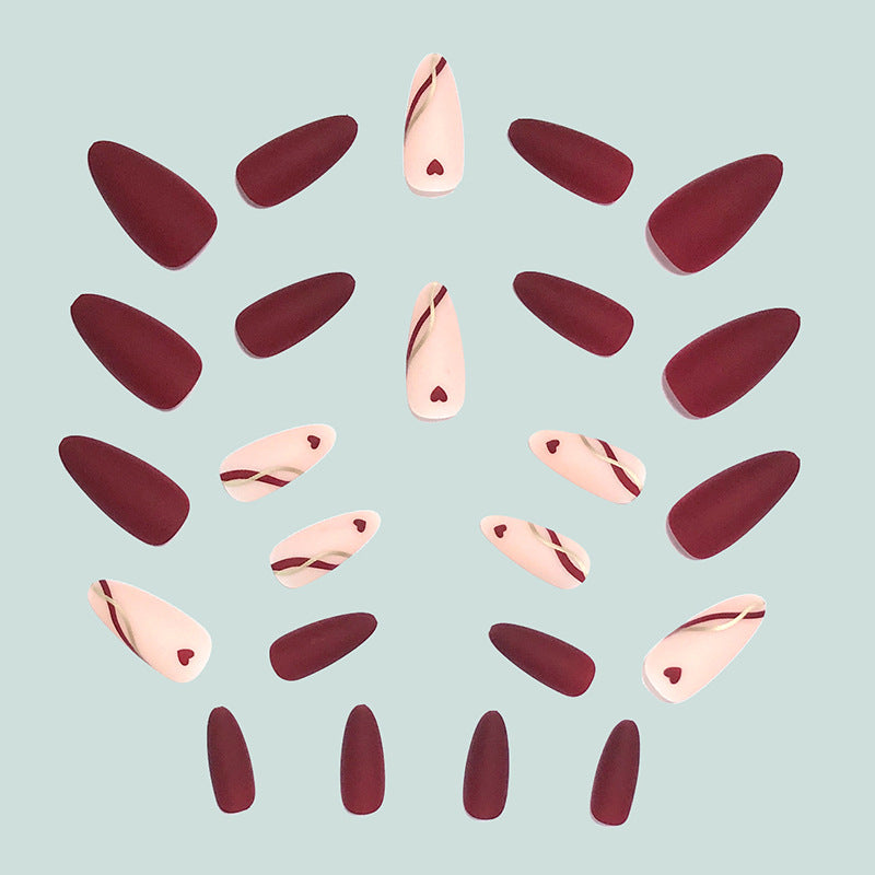 Artful and elegant artificial nails with heart decorations Bowlift