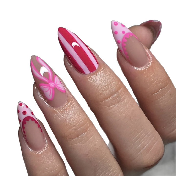 Nail set with playful bow and stripe pattern Bowlift