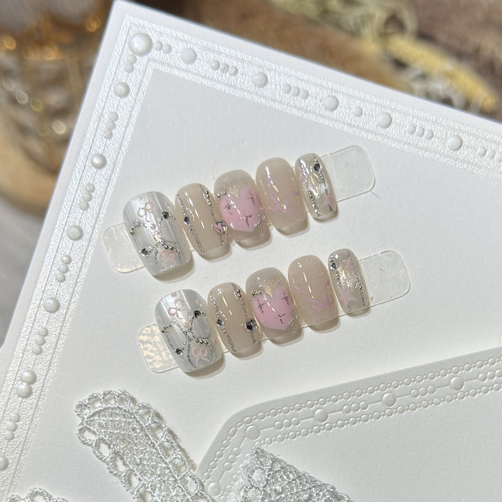 Decorative Press-On Nail Set with Heart and Silver Accents Bowlift