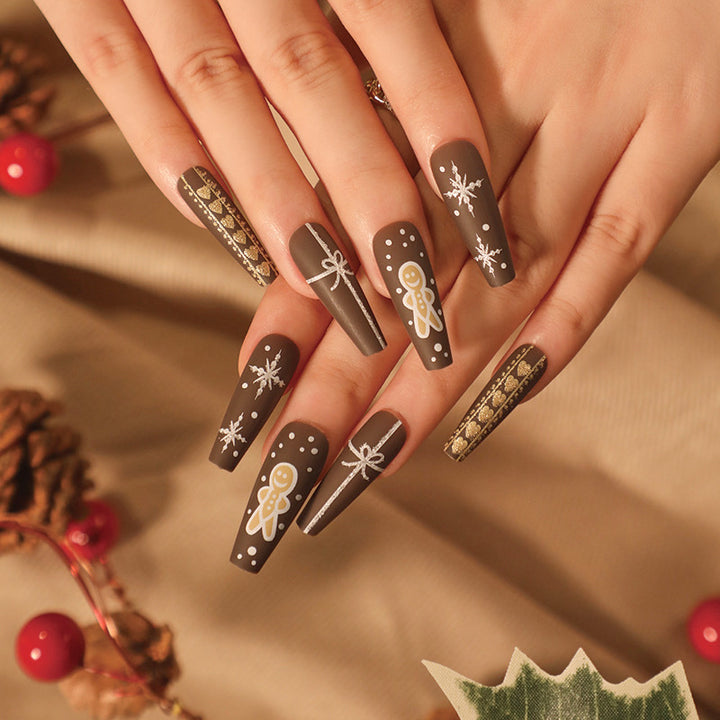 Artificial nail art with festive gingerbread design Bowlift