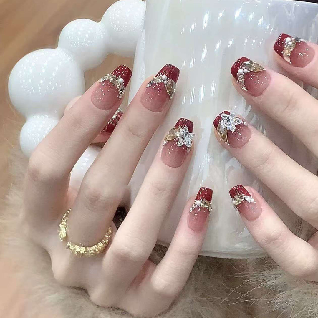 Artistic Press-On Nail Design with Gemstone Accents Bowlift