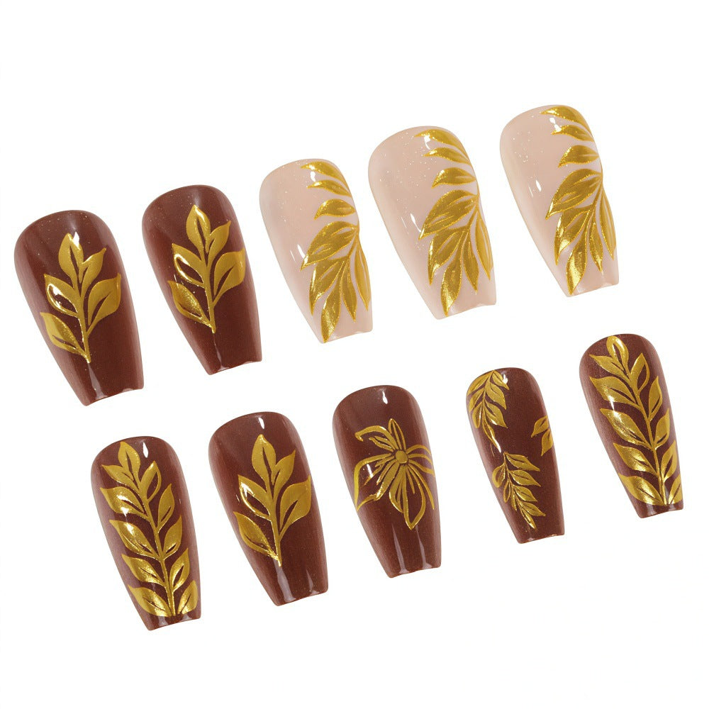 Artificial nails with floral gold design Bowlift