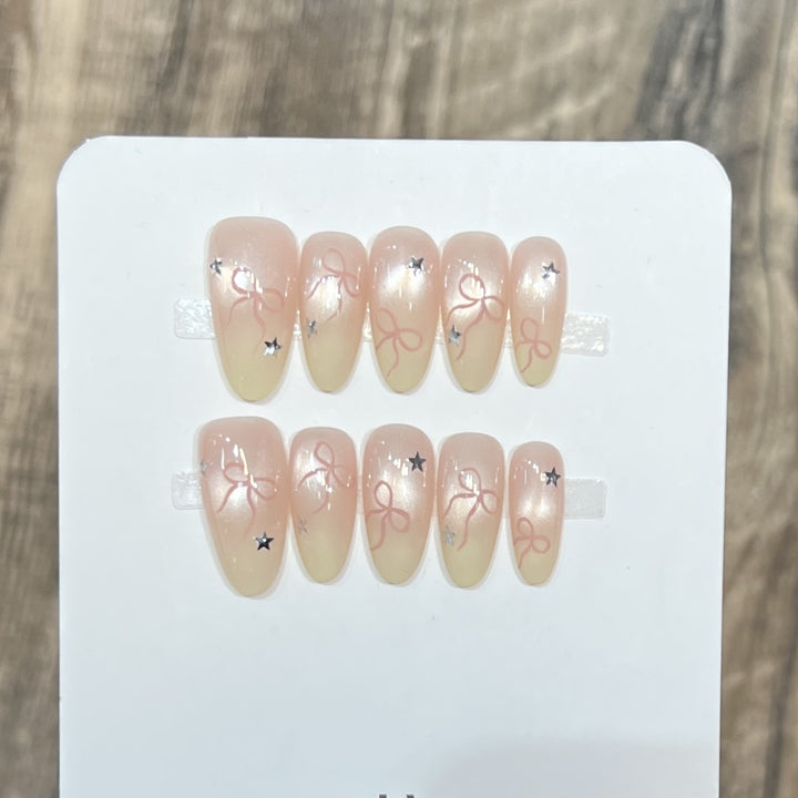 Press-On Nail Set with Bow and Star Accents Bowlift