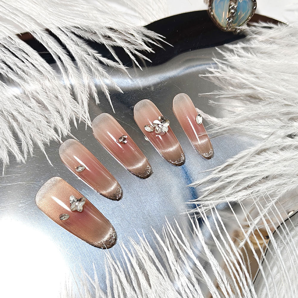 Glamorous artificial nails with rhinestone decorations Bowlift