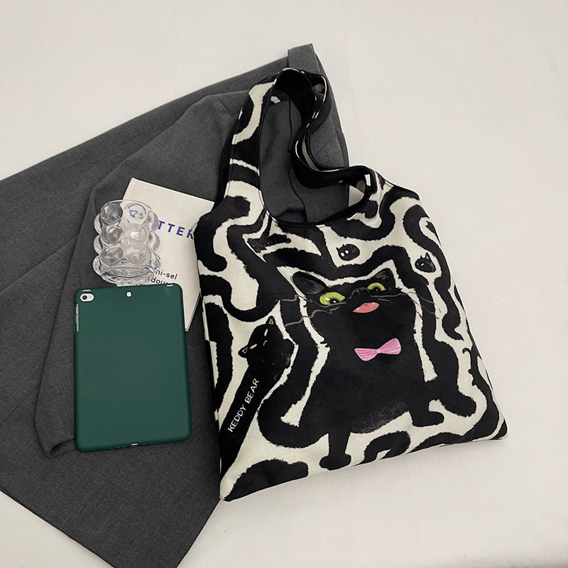 Shoulder bag with playful cat motif Bowlift