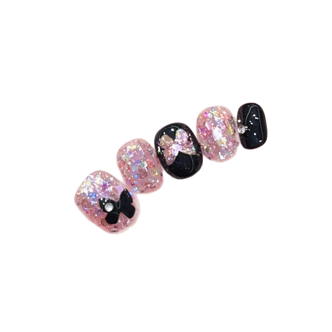 Artificial nails with glitter and bow accents Bowlift