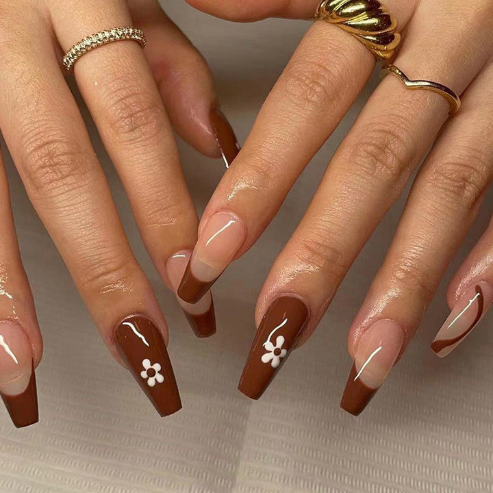 Artful Gel Nails with Elegant Floral Design and Glitter Accents Bowlift