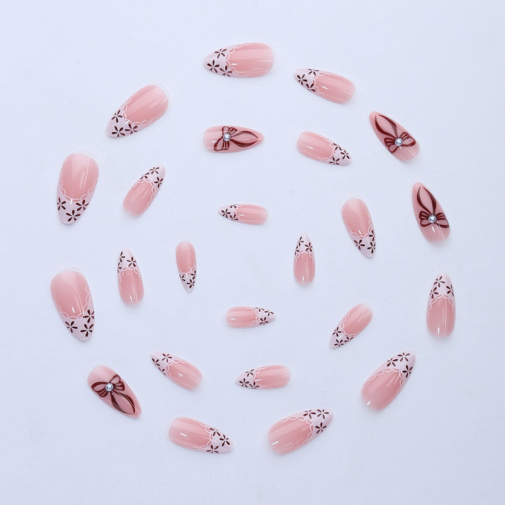 Elegant artificial nail design with floral accents Bowlift